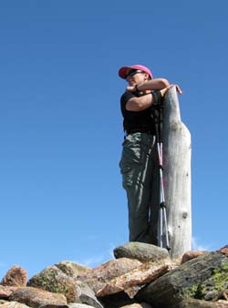 Cheryl on Dorr Mountain's summit cairn (photo by Mark Malnati)