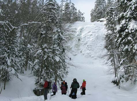 SDH at the base of Arethusa Falls and ice climbers ON the falls (photo by Mark Malnati)